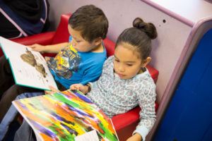 Children at daycare reading .