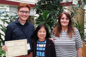 Intern William Blackmer poses with Sister Elisabeth and Hana Toma, from our Refugee Resettlement Program